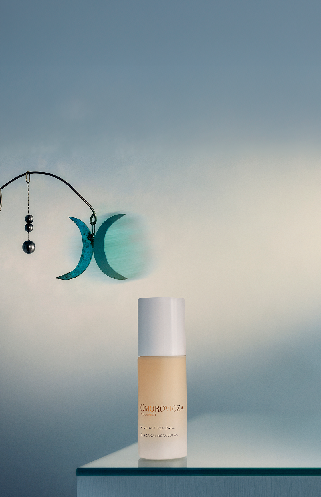 Omorovicza Midnight Renewal product banner showing the bottle and a mobile element on the back