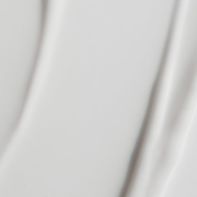 A close up of Silver Skin Lotion light and creamy texture, white colour.